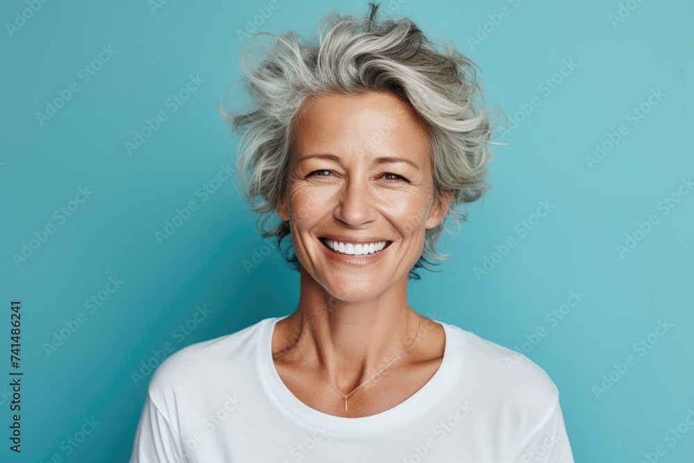 Portrait of a woman with grey hair smiling at the camera. Suitable for various projects Portrait of a woman with grey hair smiling at the camera. Suitable for various projects
