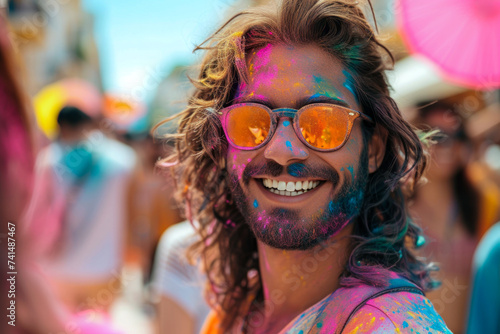 Holi Celebrations: Portrait of Joy. A young man's face is playfully adorned with vibrant Holi colors, embodying the spirit of the festival.