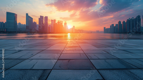 Empty square floor and modern city skyline with buildings at sunset in Ningbo, Zhejiang Province, China. photo