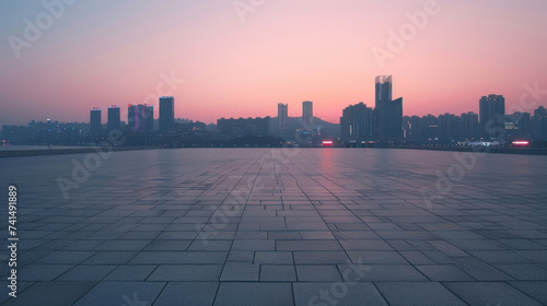 Empty square floor and modern city skyline with buildings at sunset in Ningbo, Zhejiang Province, China.