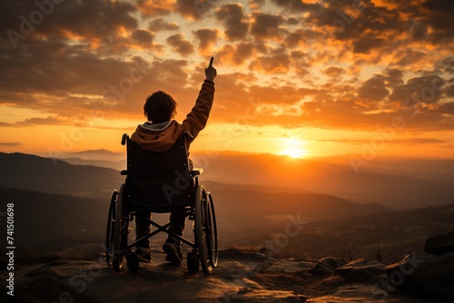 Against all odds, a boy in a wheelchair reaches the summit of a mountain, his hands raised in victory, embodying the triumph of the human spirit over physical limitations