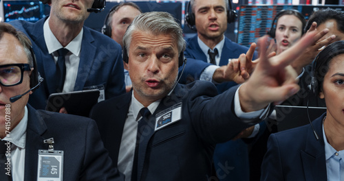 Portrait of Professional Traders Working on Stock Exchange. Enthusiastic Men and Women Shouting, Signaling Orders for Company Shares and Commodities to Brokers at an Open Outcry Arbitrage