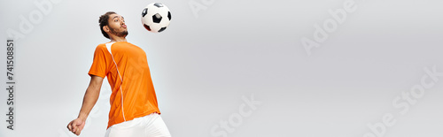 young handsome african american man in vivid comfy sportwear playing football actively, banner photo
