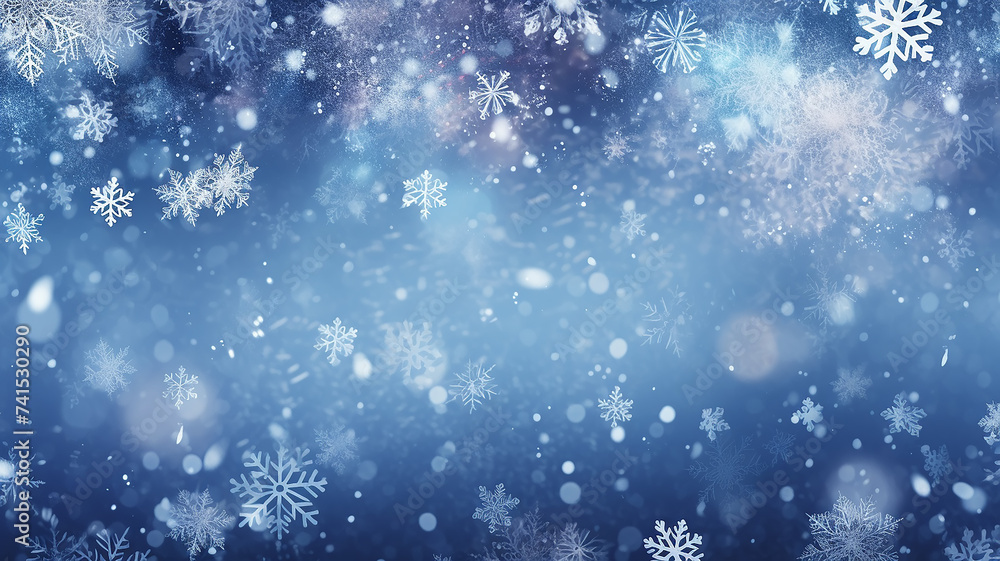 abstract blue snowflakes falling winter weather blurred background.