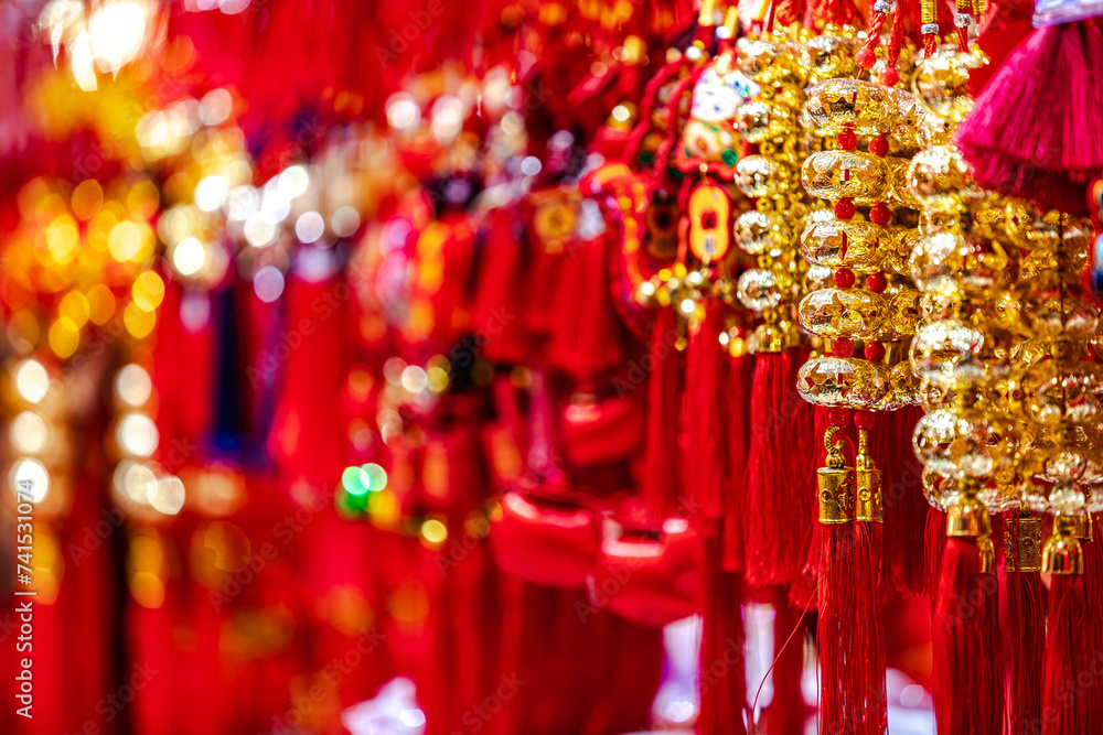 Traditional Chinese shinning golden souvenirs displayed at market gift stall in shopping area,Chenghuangmiao,Shanghai,China.