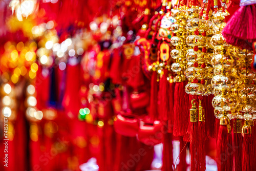 Traditional Chinese shinning golden souvenirs displayed at market gift stall in shopping area Chenghuangmiao Shanghai China.