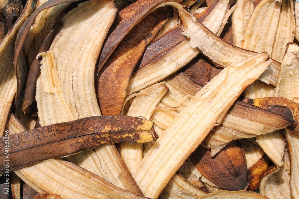 Close up of banana peel. Peeled banana with dark skin. Rotten banana texture. Good source of organic homemade fertilizer. Zero waste, sustainable living concept. Natural plant compost. Organic waste
