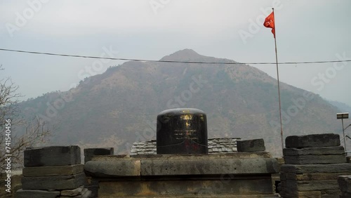 Big Shiva Linga Sculpture: Lakhamandal Temple, Himalayan Mountains Background photo
