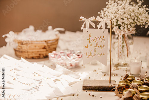 Wedding favors and wedding bubbles on a decorated table of a wedding.