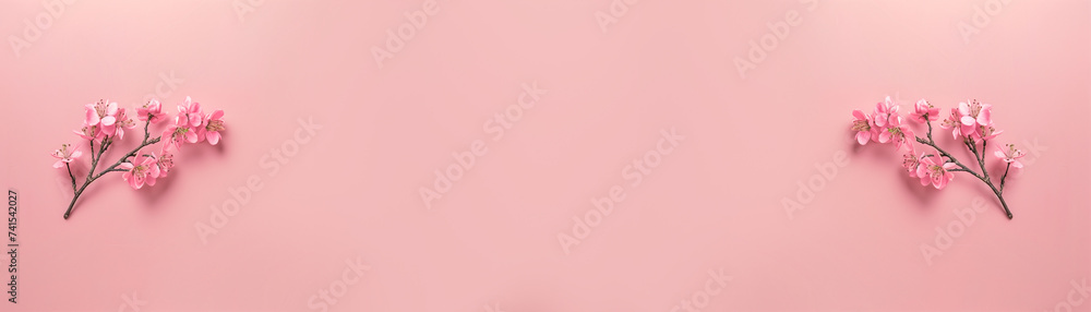 Pink spring minimal banner with blooming tree branch. Background with copy space.