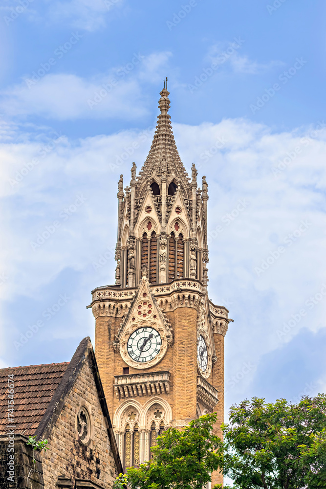 Close up,image of Iconic , Ancient Rajabai Tower building with clock and blue sky background.
