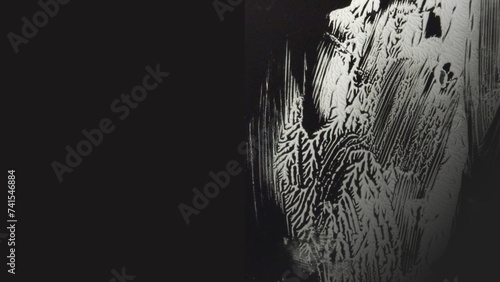Oriental and mysterious pattern of decalcomania with white acrylic paint on black background                     
