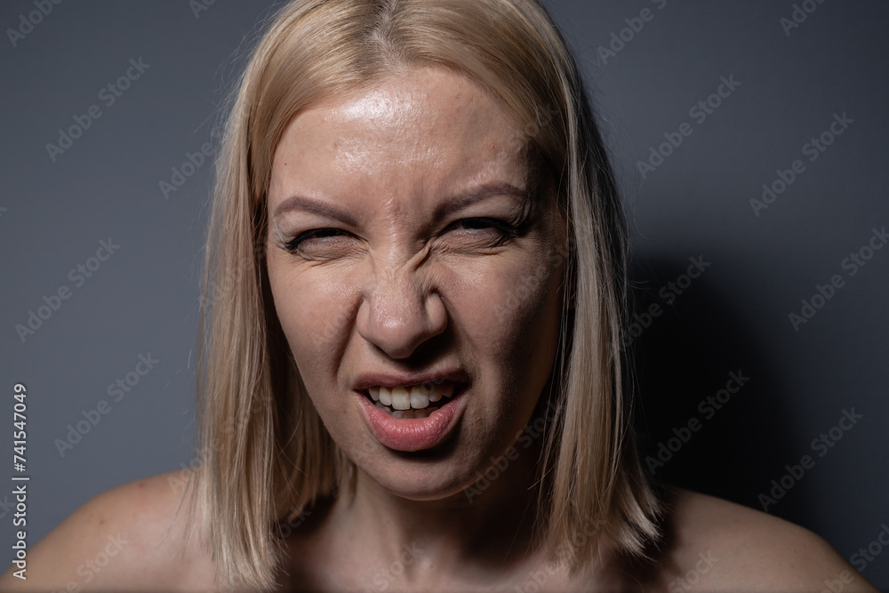 BLOND GIRL MAKES GRIMES AT CAMERA BLOND GIRL MAKES GRIMES AT CAMERA