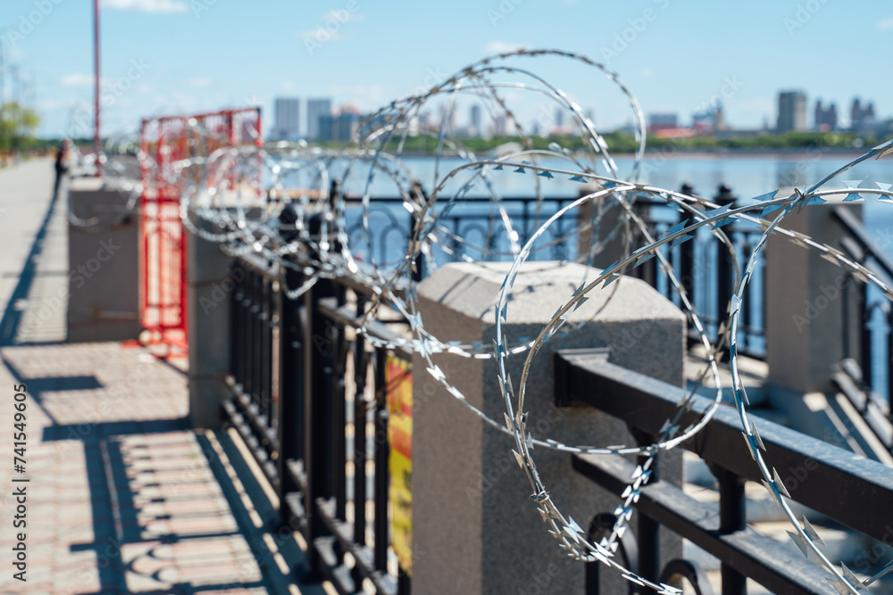 Fence with barbed wire. No entry. The border is guarded