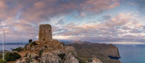 view of the Albercutx watchtower at Cap de Formentor in northwestern Mallorca at sunrise photo
