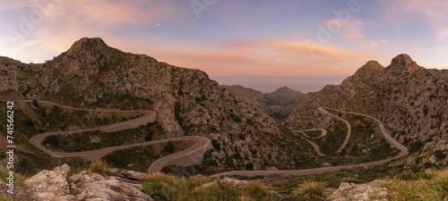 sunrise in the Tramuntana mountains of Mallorca with a view of the landmark snake road leading down to Sa Calobra
