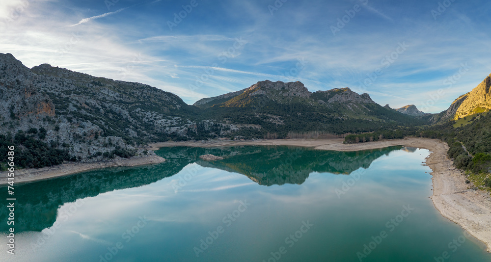 Fototapeta premium aerial view of the picturesque Gorg Blau mountain lake and reservoir in the Serra de Tramuntana mountains of northern Mallorca