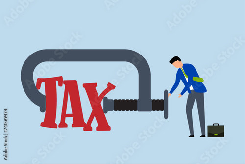 Fotografija Tax payment reduction, Businessman with extensive experience managing money uses clamping to constrict the term tax metaphor of reduction