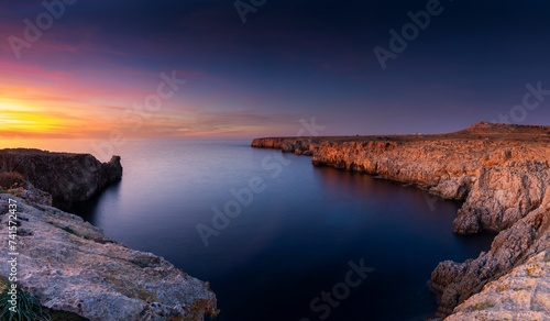 cliffs and rugged shorelina at Pont d'en Gil in northeastern Menorca near Ciutadella just after sunset photo