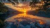 Serene sunset over a calm lake, reflecting the golden sky and silhouetted trees