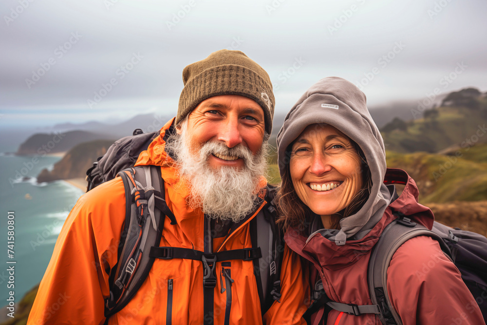 Portrait of an elderly couple traveling together, admiring the beautiful landscape and nature, feeling young and free