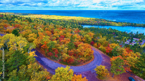 Aerial Autumn Splendor with Winding Road and Lake in Michigan
