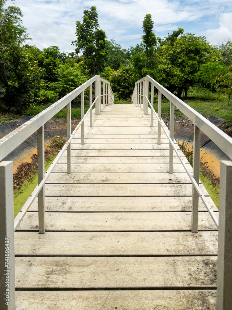 The white wooden bridge above the empty reservoir.