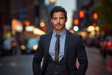 Energetic young Latino man in a charcoal blazer, reflecting the vibrant urban life in his dark eyes