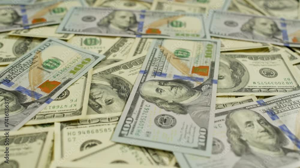 A large number of old and new dollars are scattered on the table. Cash is the national currency of the United States of America. High quality 4k footage A large number of old and new dollars are scattered on the table. Cash is the national currency of the United States of America. High quality 4k footage