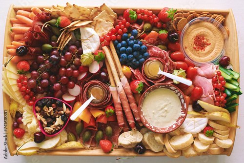 Antipasto platter with meat, chease, fruits, vegetables and nuts. Appetizer, catering food concept photo