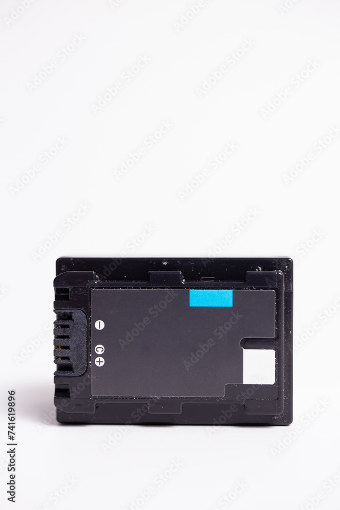 Black rectangular camera battery on white background Black rectangular camera battery on white background