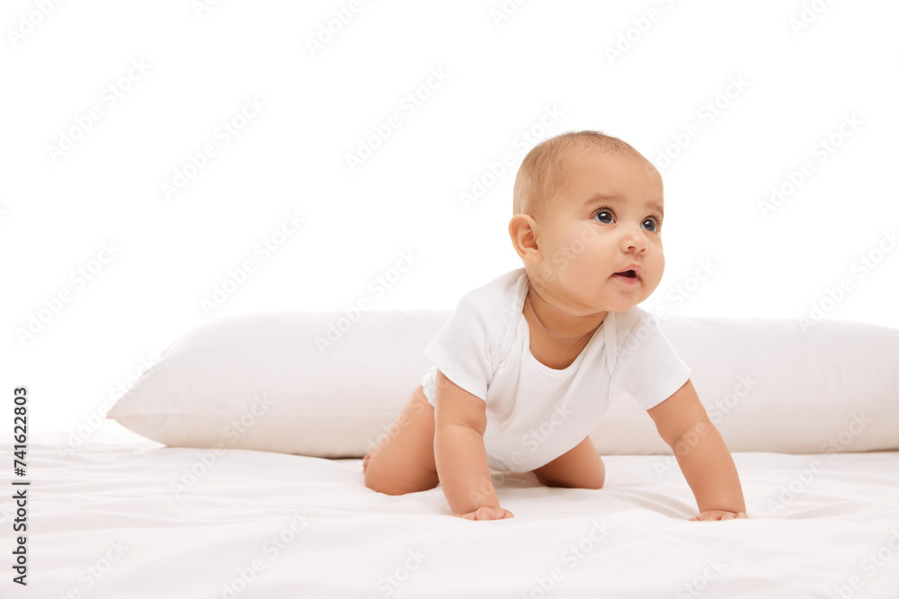 Adorable little baby girl, toddler in white clothes, crawling on bad with pillows against white background. Leisure, movements. Concept of childhood, family, care, motherhood, infancy, heath Adorable little baby girl, toddler in white clothes, crawling on bad with pillows against white background. Leisure, movements. Concept of childhood, family, care, motherhood, infancy, heath