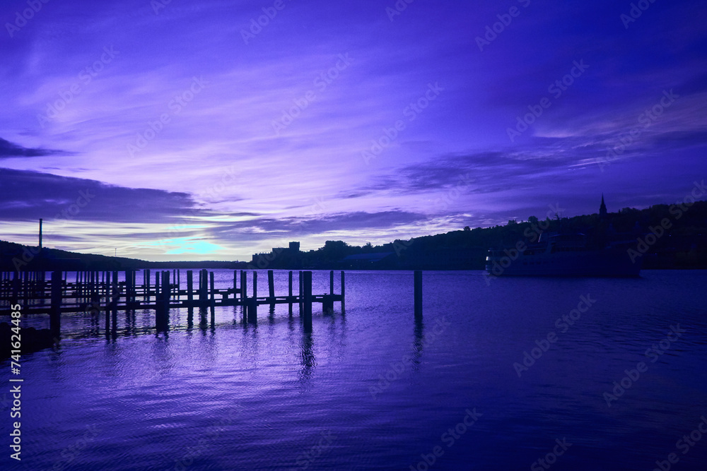 Twilight Waterfront with Pier and Moored Boat, Reflections on Calm Water Infrared