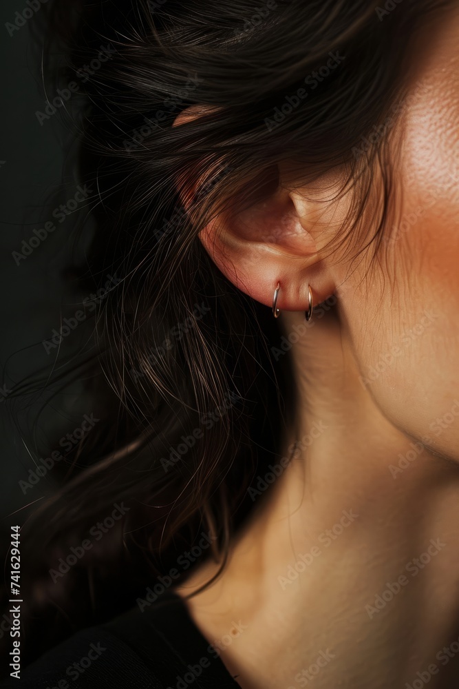 Macro image of a female ear, concept of healthy hearing or ear jewelry	
