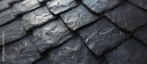 Detailed view of wall texture randomly lined with slate panels typical and traditional shale stone material used as external waterproof cladding in construction. with copy space image photo