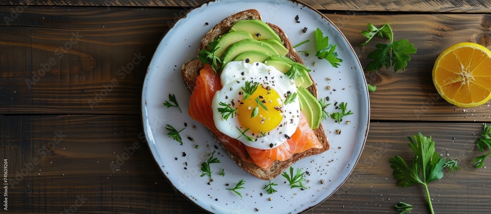 Toast with salmon poached egg and avocado on a white plate Poached egg with salmon and guacamole on rye bread. with copy space image. Place for adding text or design