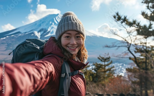 Fuji Explorer: An Influencer's Odyssey - A Young Woman Chronicles Her Adventure with a Backpack Selfie near Mount Fuji in Tokyo, Japan, Embracing Nature's Spectacle.    © Mr. Bolota