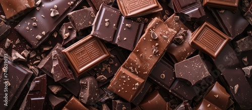 Pile of assorted chocolate bars close up. with copy space image. Place for adding text or design