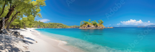 Panorama of a secluded beach with white sand and turquoise water
