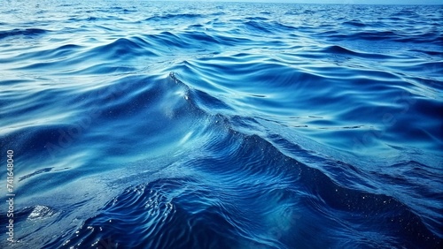 Blue sea water background. Texture of water surface. Natural background.