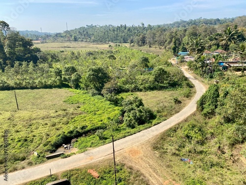 Aerial view of a road passing through a hill village around the town of Sakleshpur. photo