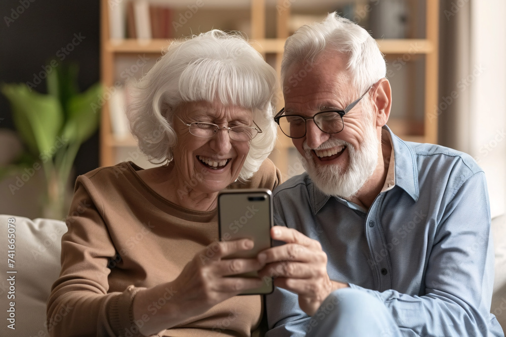 Happy retired family couple using mobile phone for video call Happy retired family couple using mobile phone for video call