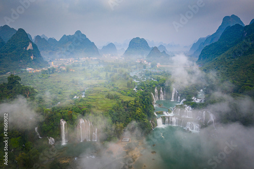 Aerial view of Detian Transnational Waterfalls along the river at Moon Hill Yangshuo valley, Chongzuo City, Yangshuo County, Guilin, Guangxi Zhuang Autonomous Region, China. photo