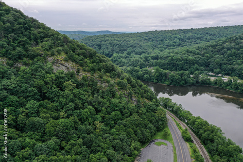 Aerial Drone View of a road along the Delaware River among the mountains in Poconos, Pennsylvania, United States. photo