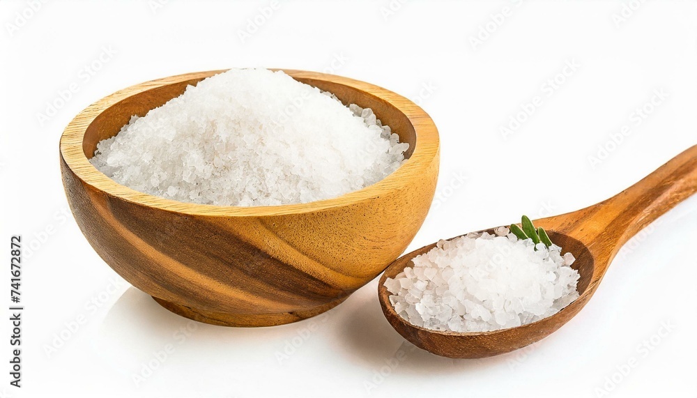 Pure natural sea salt in wooden bowl and wooden spoon isolated on white background. Pure natural sea salt in wooden bowl and wooden spoon isolated on white background.