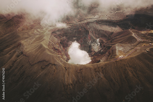 Aerial shot of Mount Aso Crater erupting, Kumamoto Prefecture, Kyushu, Japan. photo