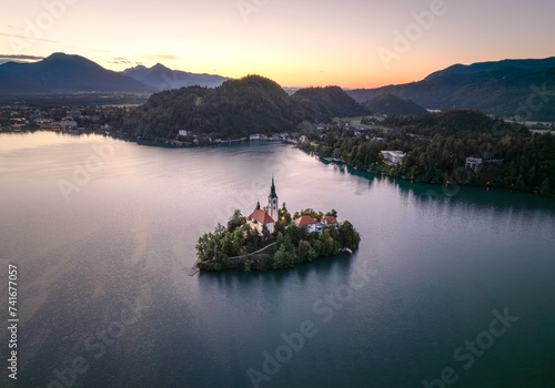 Aerial drone view of church on small island in middle of lake Bled, Slovenia. photo