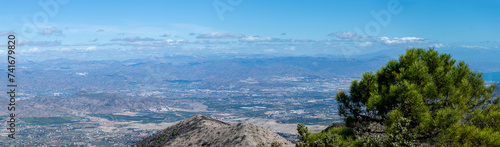 Panoramic view on Mediterranean sea and surrounding cities from Mijas peak, Andalusia, Malaga, Spain #741679820