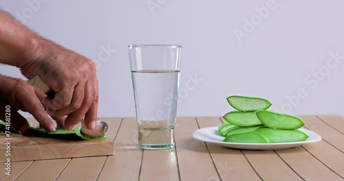  video of aloe vera being cut and chopped on wooden chopping board and washed in water