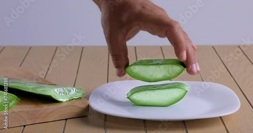  video of aloe vera being cut and chopped on wooden chopping board and washed in water